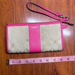 Coach pink and tan wristlet